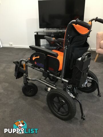 Merits Classic E-Power Wheelchair. As new. Will deliver. Reduced to sell