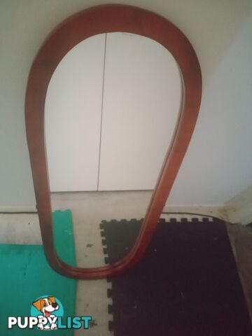 Standing mirror without stand .