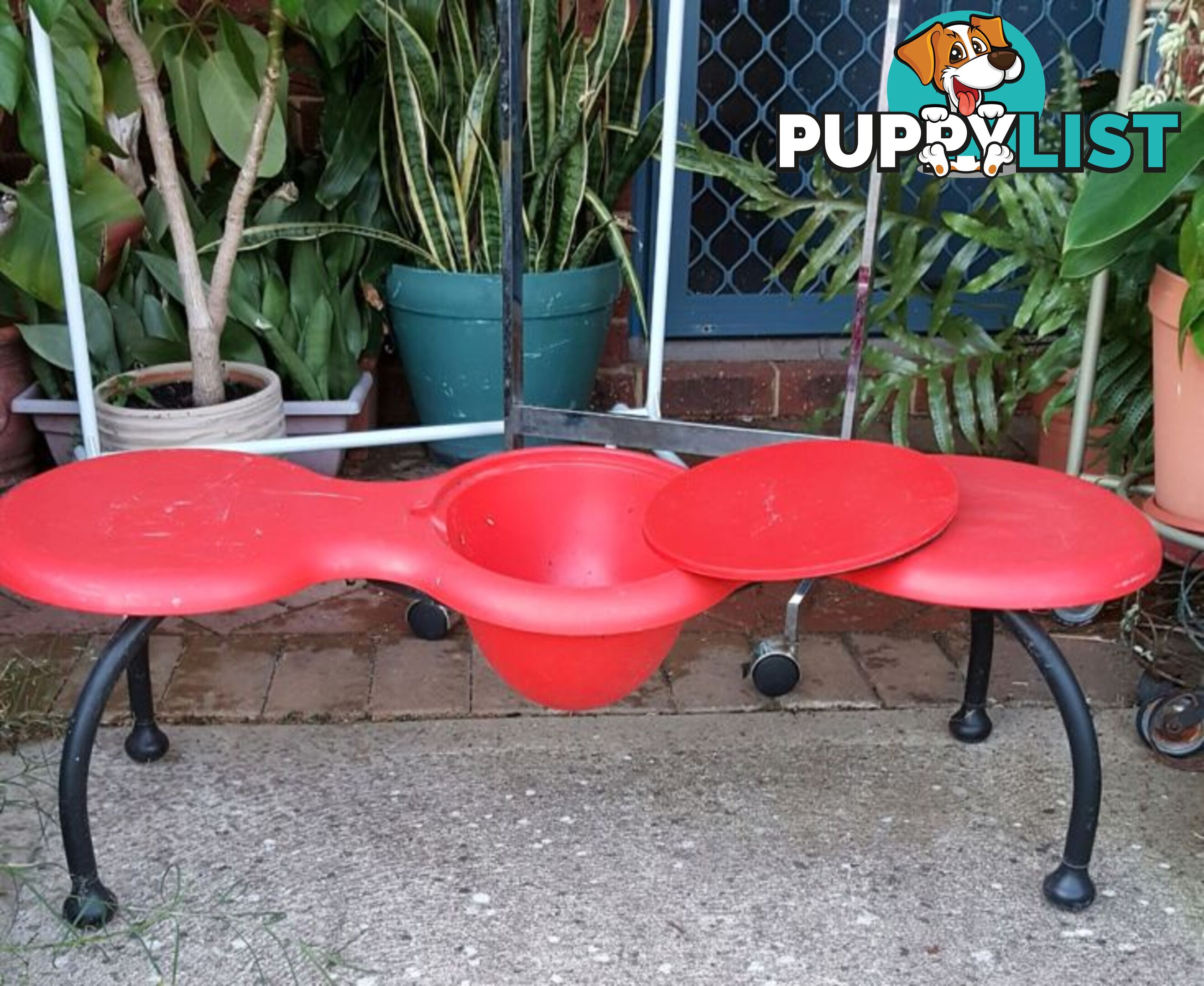 Red bench for flowers in pots