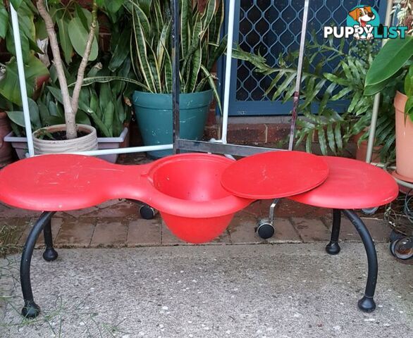 Red bench for flowers in pots