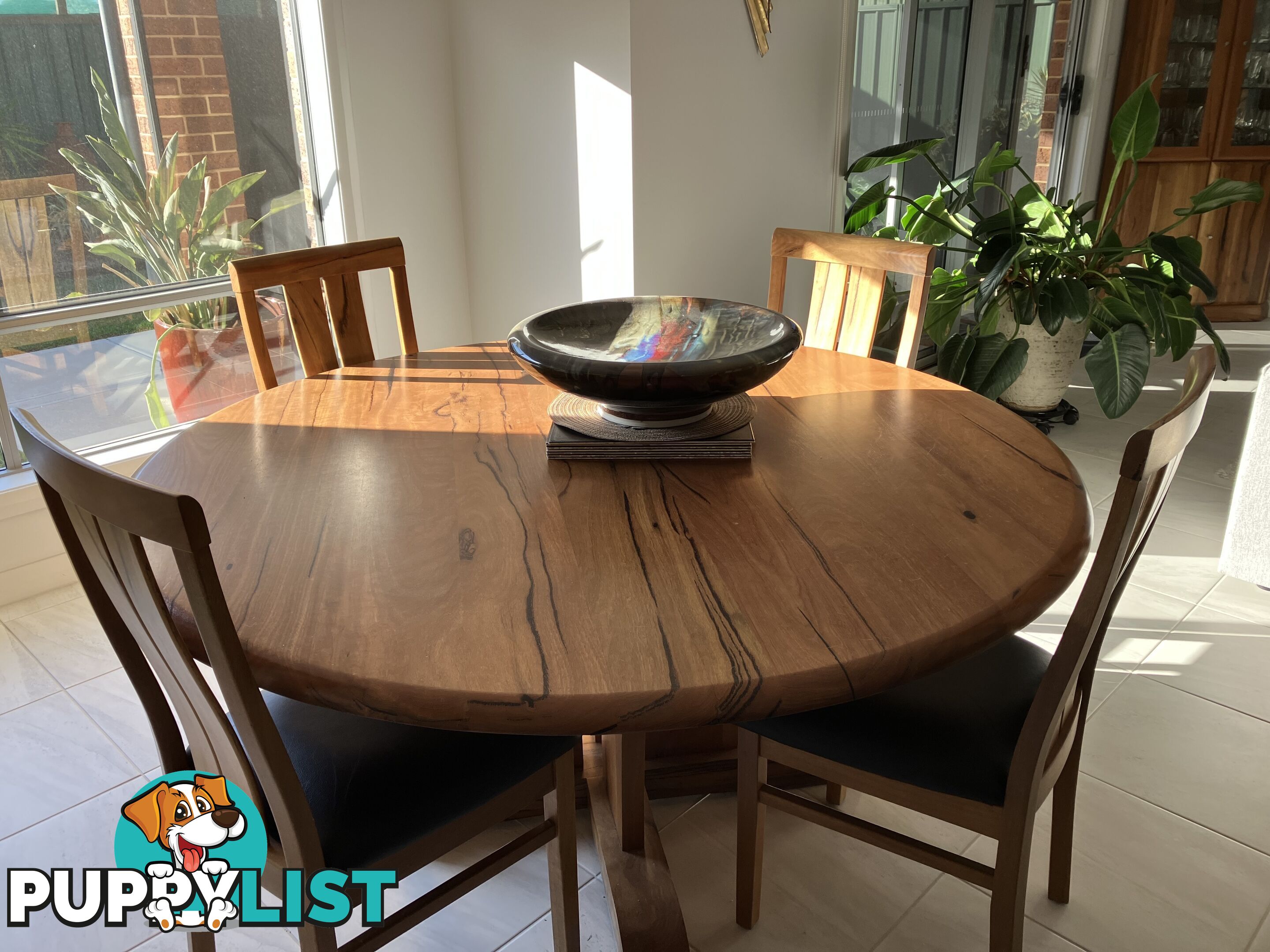 Round Dinning Kauri timber dinning table and 6 leather seat dinning chairs