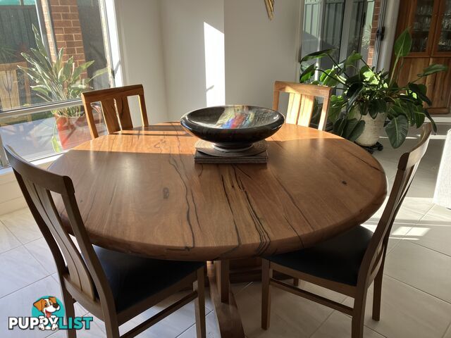 Round Dinning Kauri timber dinning table and 6 leather seat dinning chairs