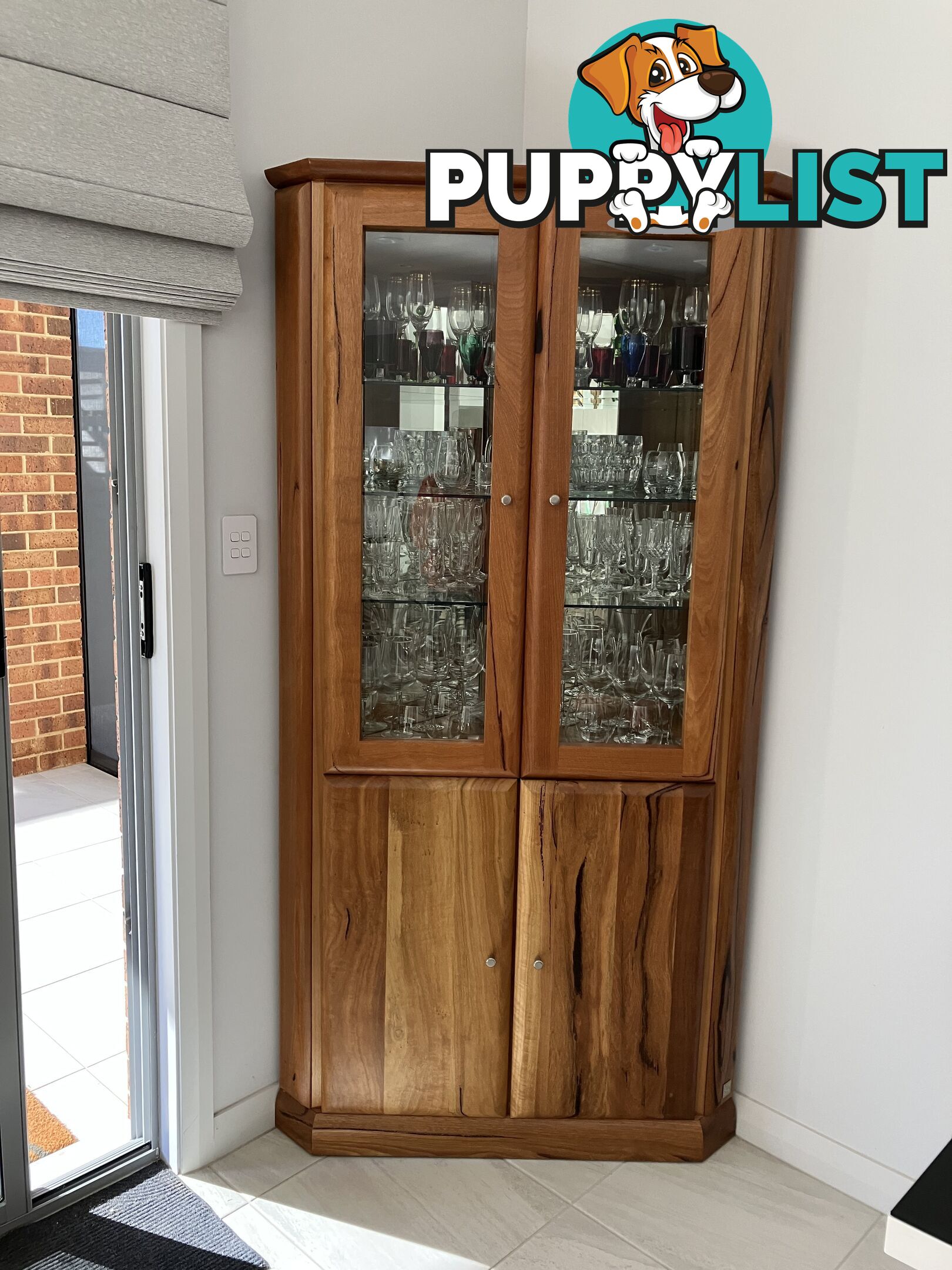 Jamel manufactured glass Kauri timber corner cabinet