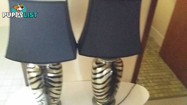 2 lamps with black stripes and shades