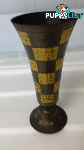 small black and molten yellow vase