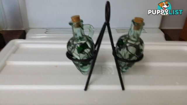 oil and vinegar bottles on a stand