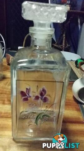 decanter with floral design on it