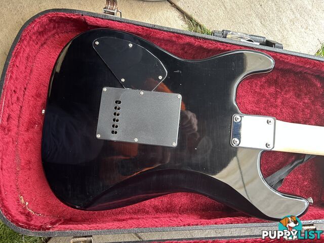 Electric guitar, small amp and hard case