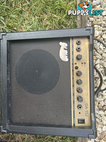 Electric guitar, small amp and hard case