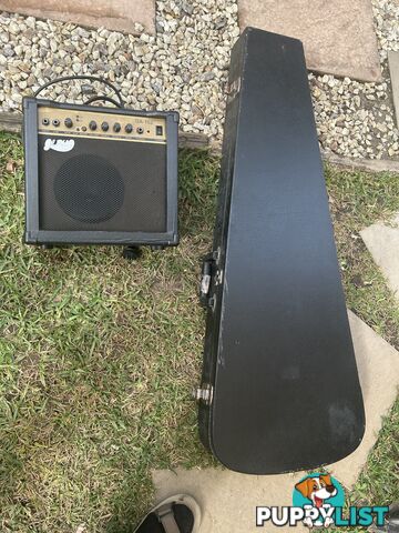 Electric guitar, small amp and hard case