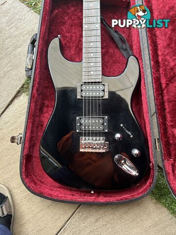 Electric guitar, small amp and hard case