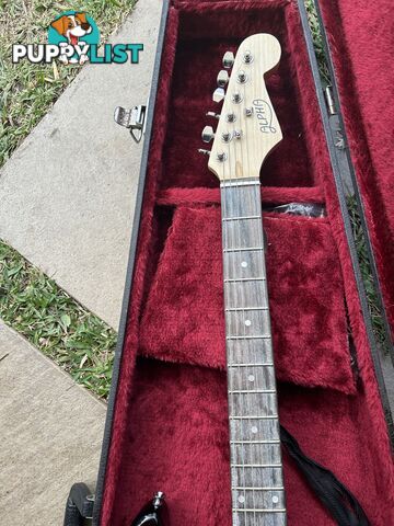 Electric guitar, small amp and hard case