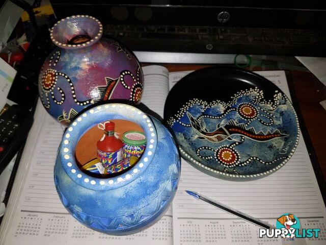 hand painted clay pots and plate