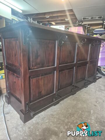 Solid timber bar with foot rail