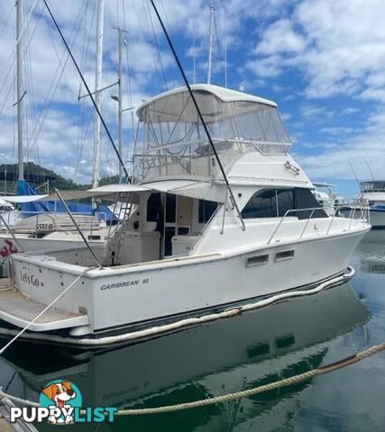 2006 CARIBBEAN 40 FLYBRIDGE BOAT, TWIN CUMMINS TWIN SHAFT DRIVE