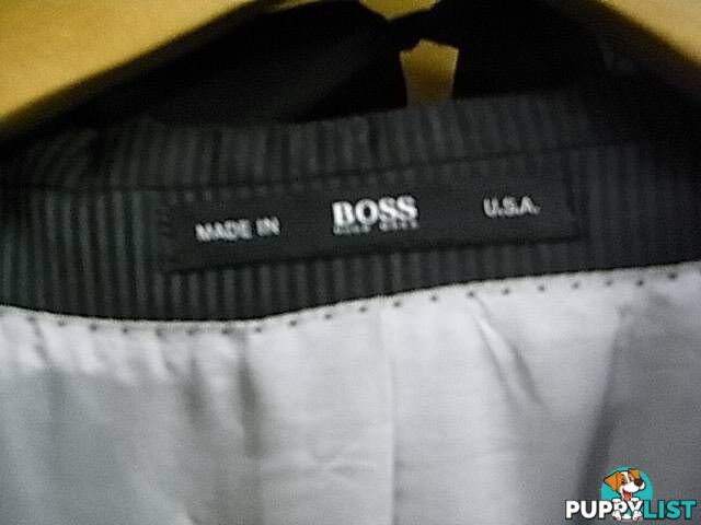 HUGO BOSS SUIT MADE IN USA. JACKET SIZE 44L pants 34 inch EXCEL