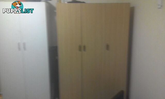 Light brown chipboard wardrobe $70 ono negotiable excellent cond