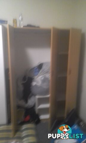 Light brown chipboard wardrobe $70 ono negotiable excellent cond