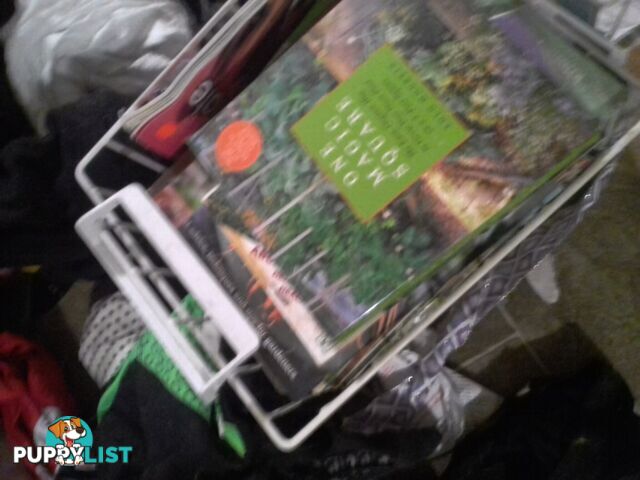 big stack of gardening magazines and books