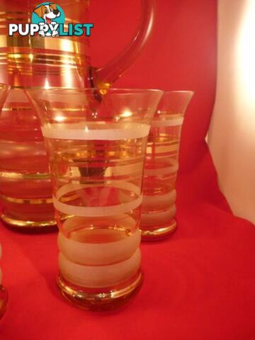 vintage golden ringed jug and 5 glasses