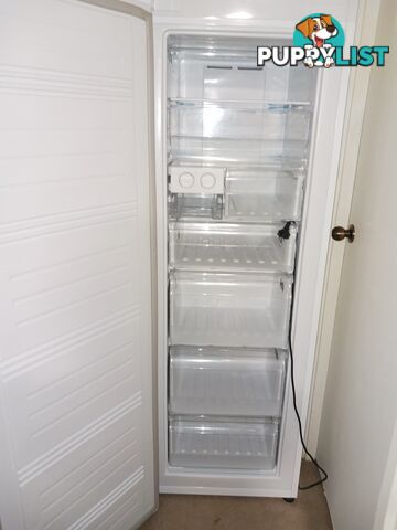 A matching pair, white fridge and freezer.