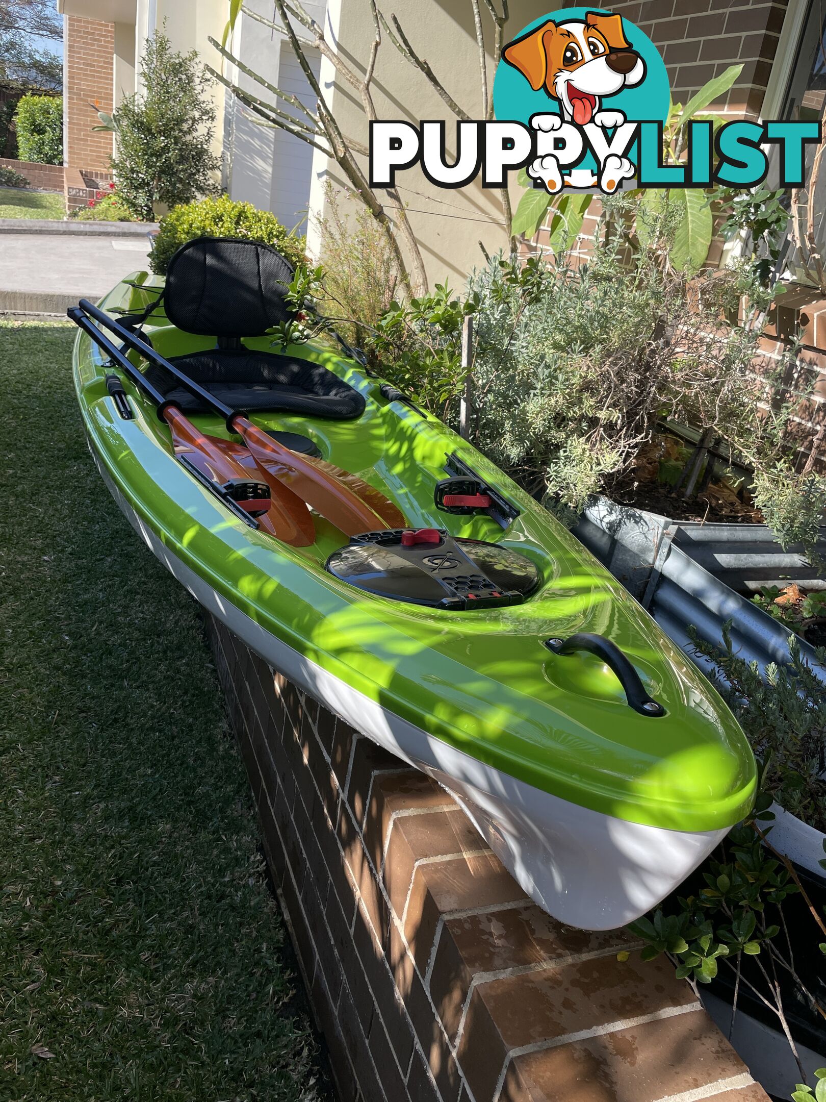 Kayak Hurricane Skimmer 206 with light weight split paddle and gas filled vest.