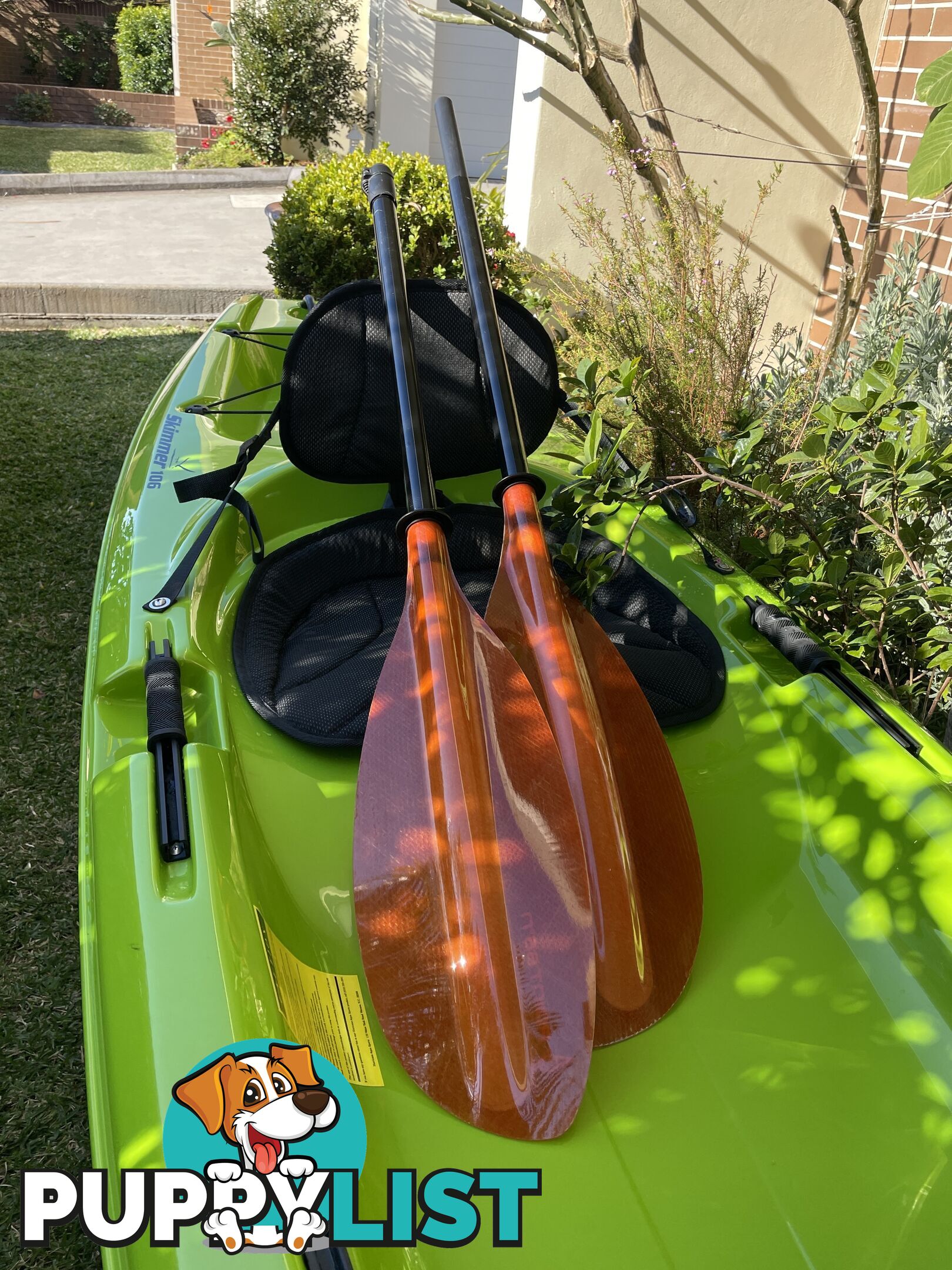 Kayak Hurricane Skimmer 206 with light weight split paddle and gas filled vest.