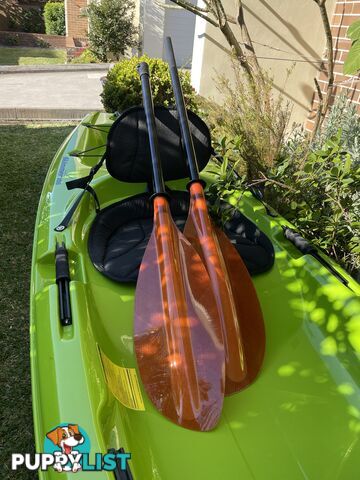 Kayak Hurricane Skimmer 206 with light weight split paddle and gas filled vest.