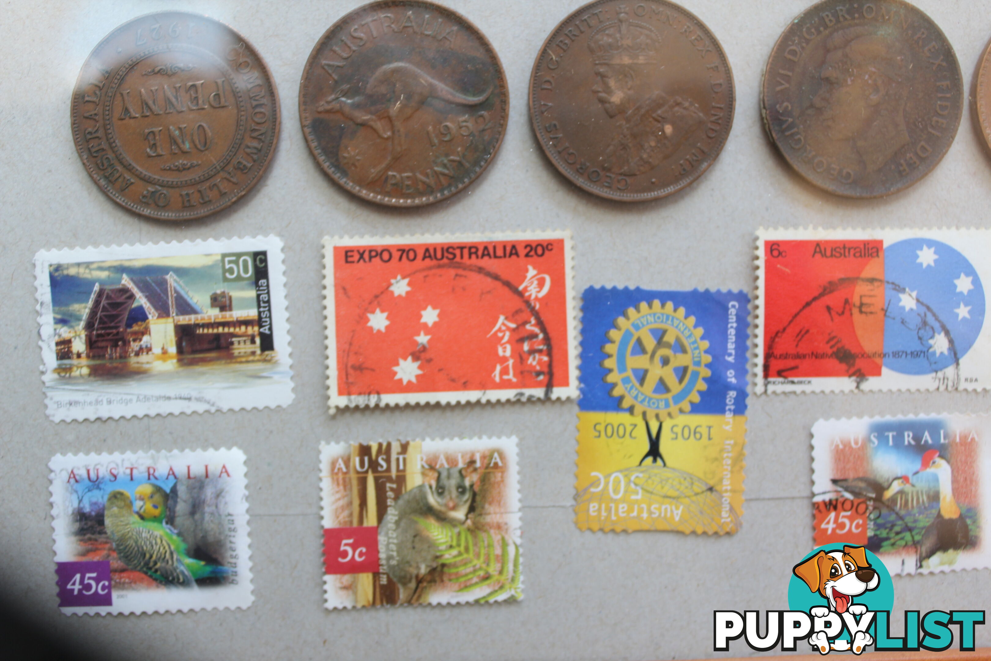 Penny&amp;#39;s and old stamps in picture frame