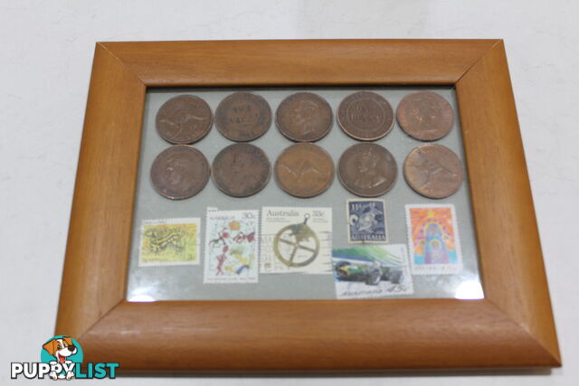 Penny's and old stamps in picture frame