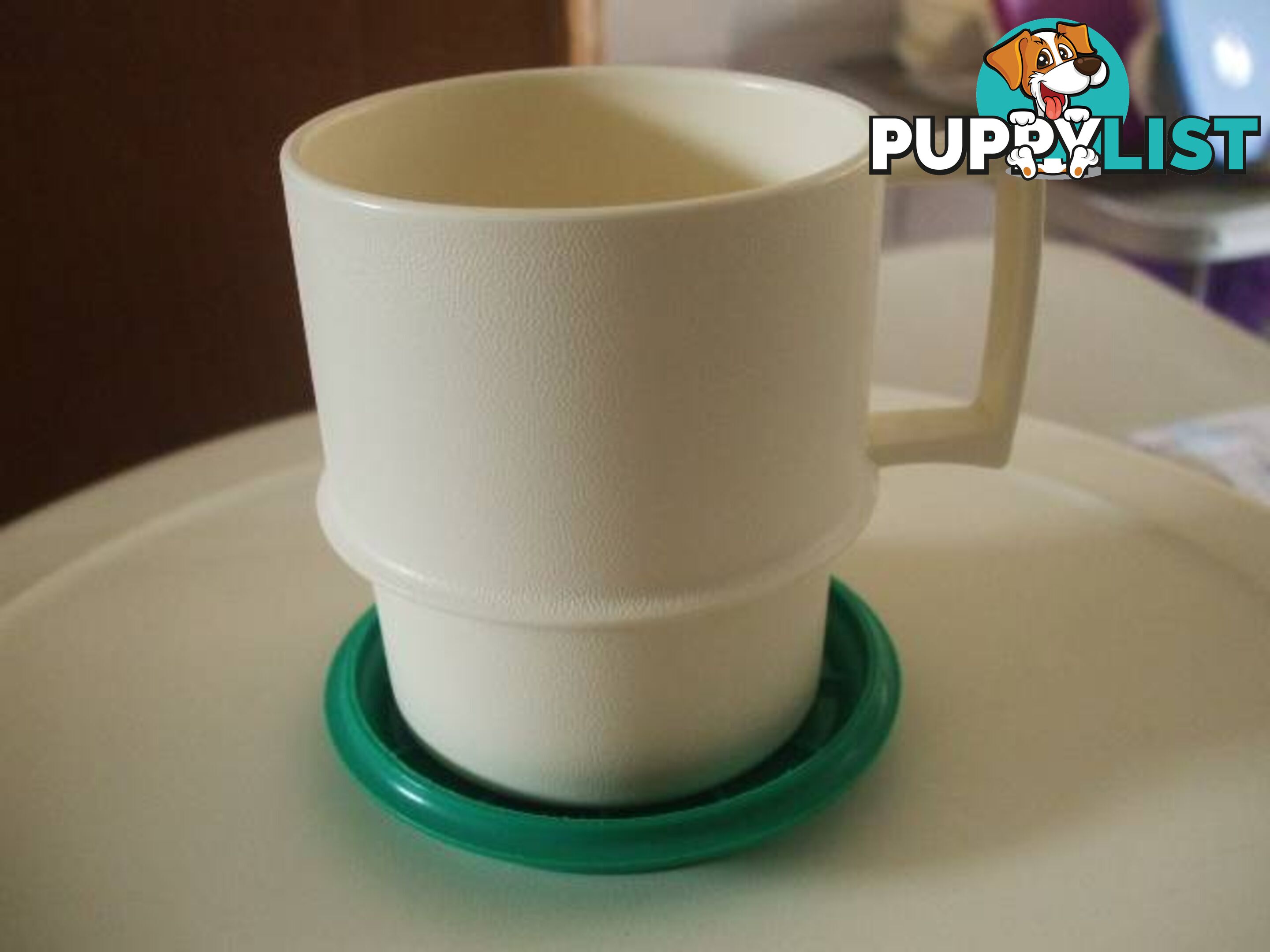 Four Tupperware Cups with Coasters/Lids