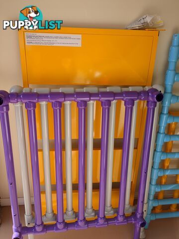 Bright, multicolor metal cot.