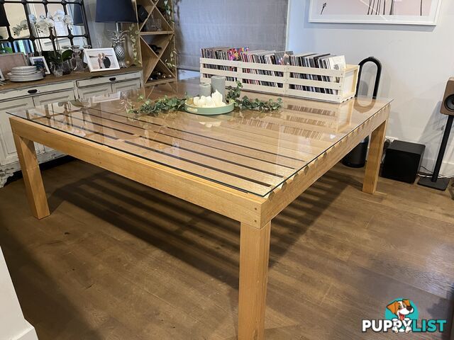 Large table with glass top.