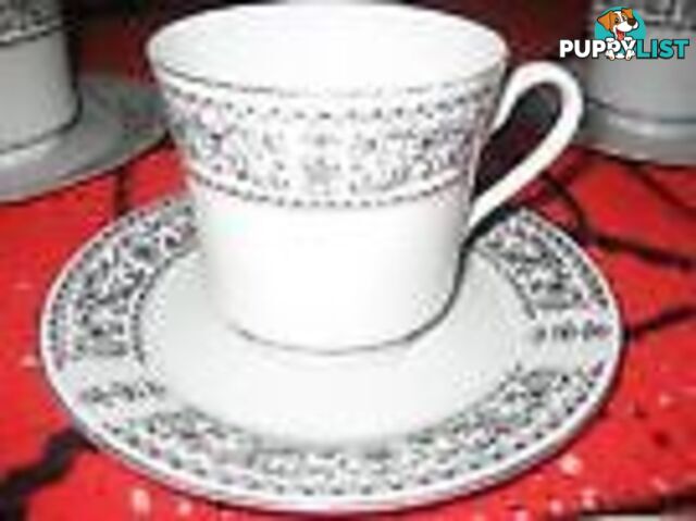 SET OF 5 TEACUPS AND MATCHING SAUCERS