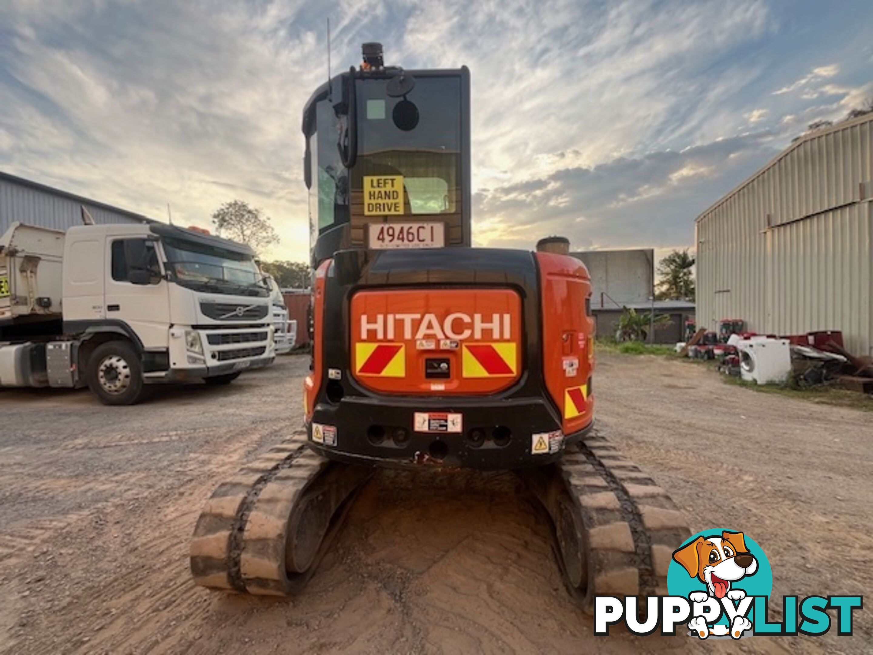 2022 5.5T Hitachi exc, attachments, 75HP TL8 positrak on a Nissan UD flatbed with hydraulic ramps