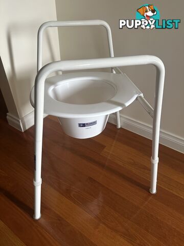 Over toilet seat rails and splash guard