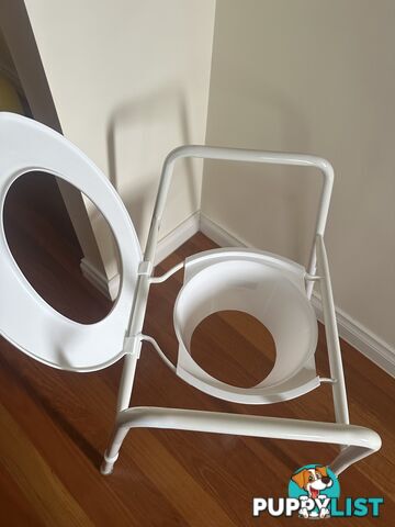 Over toilet seat rails and splash guard