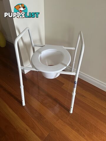 Over toilet seat rails and splash guard