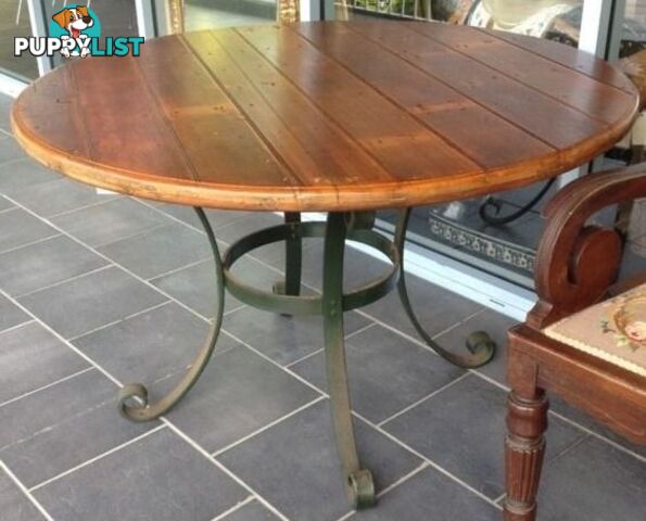 Outdoor dining table base for outdoor setting. Wrought iron base