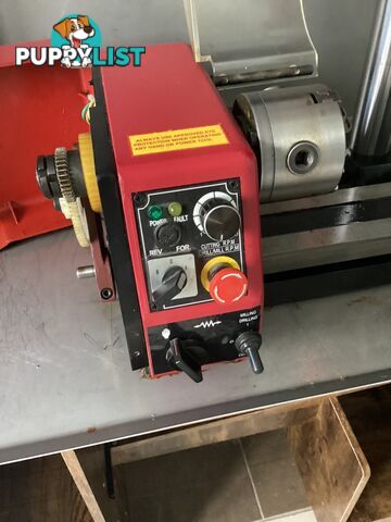 bench lathe with 3 jaw chuck and vertical milling attatchment.