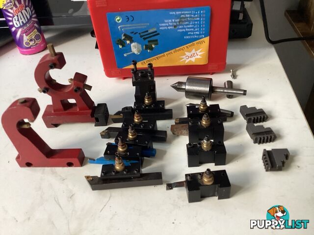 bench lathe with 3 jaw chuck and vertical milling attatchment.