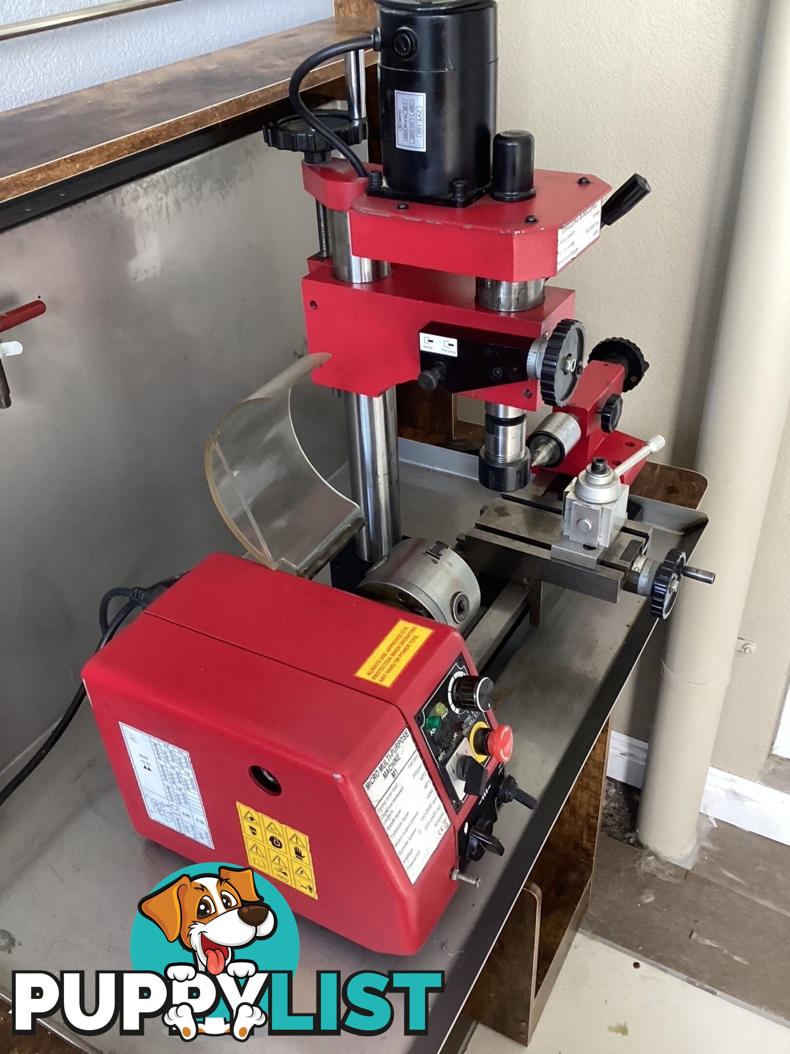 bench lathe with 3 jaw chuck and vertical milling attatchment.