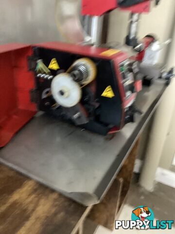 bench lathe with 3 jaw chuck and vertical milling attatchment.