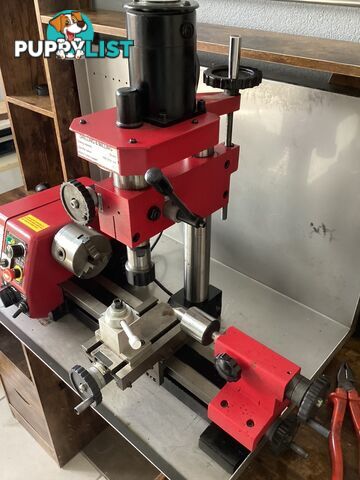 bench lathe with 3 jaw chuck and vertical milling attatchment.