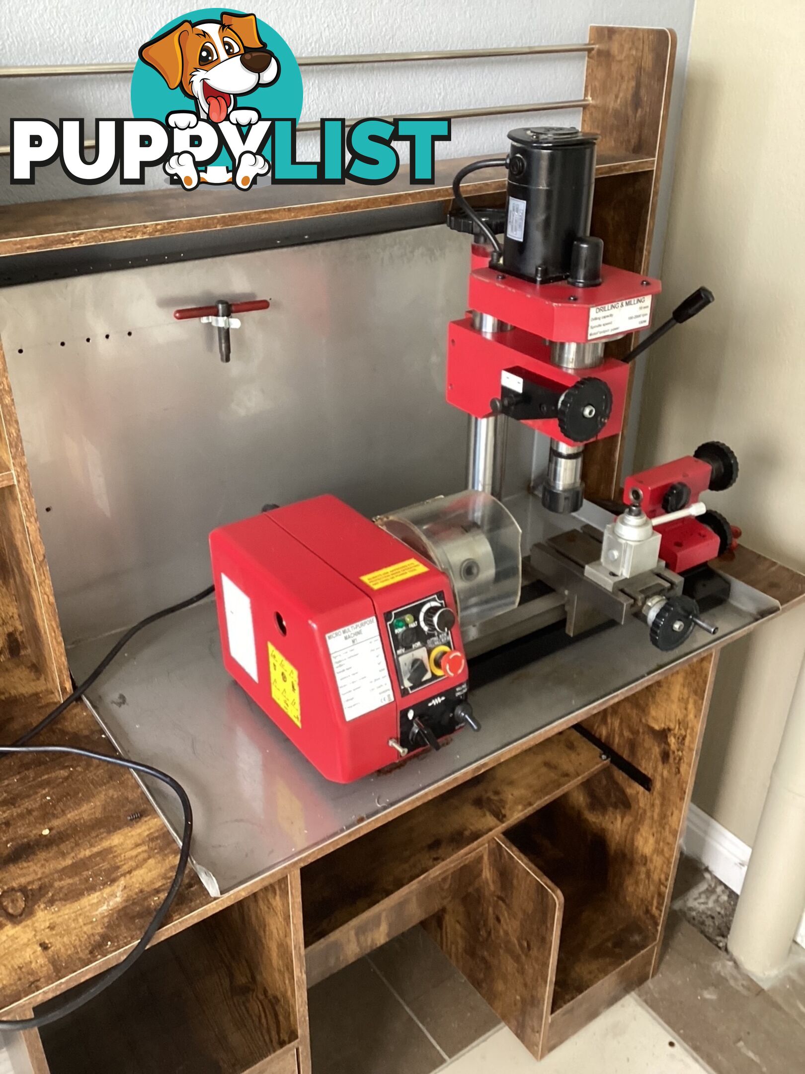 bench lathe with 3 jaw chuck and vertical milling attatchment.