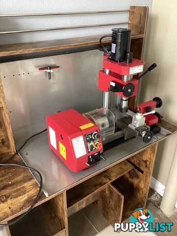 bench lathe with 3 jaw chuck and vertical milling attatchment.