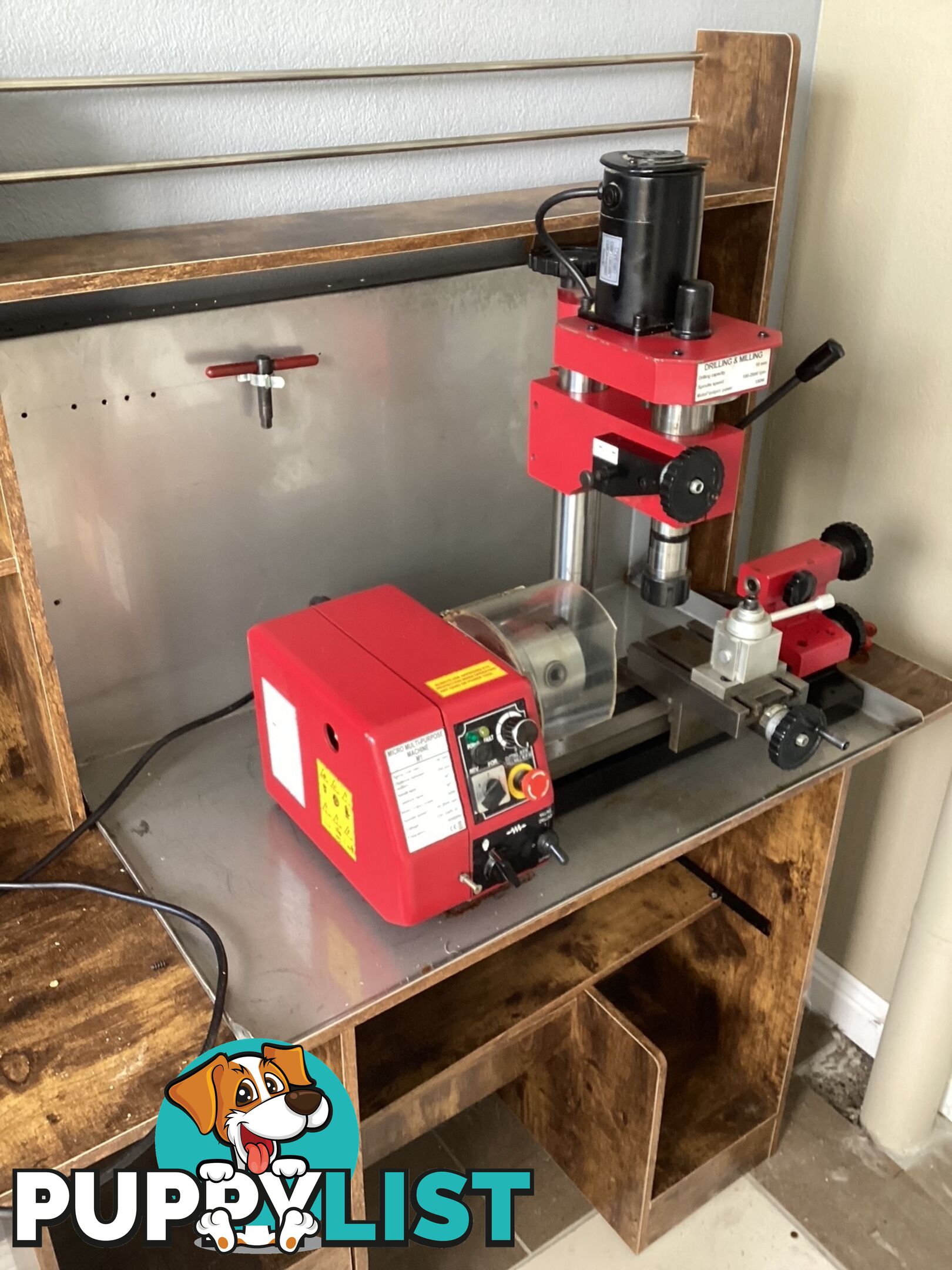 bench lathe with 3 jaw chuck and vertical milling attatchment.
