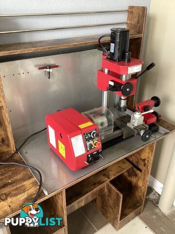 bench lathe with 3 jaw chuck and vertical milling attatchment.