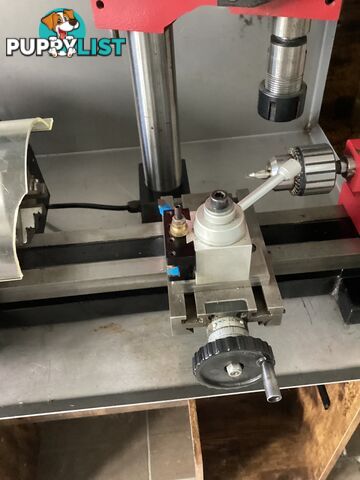 bench lathe with 3 jaw chuck and vertical milling attatchment.