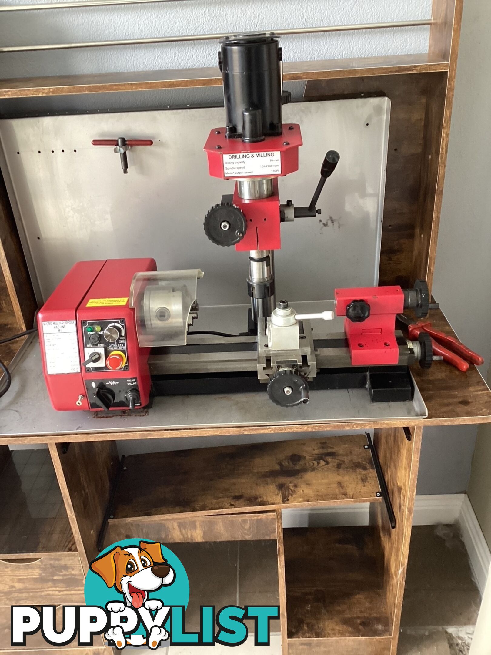 bench lathe with 3 jaw chuck and vertical milling attatchment.